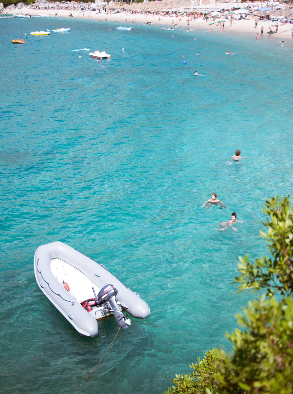 motorboat and people on sea shore
